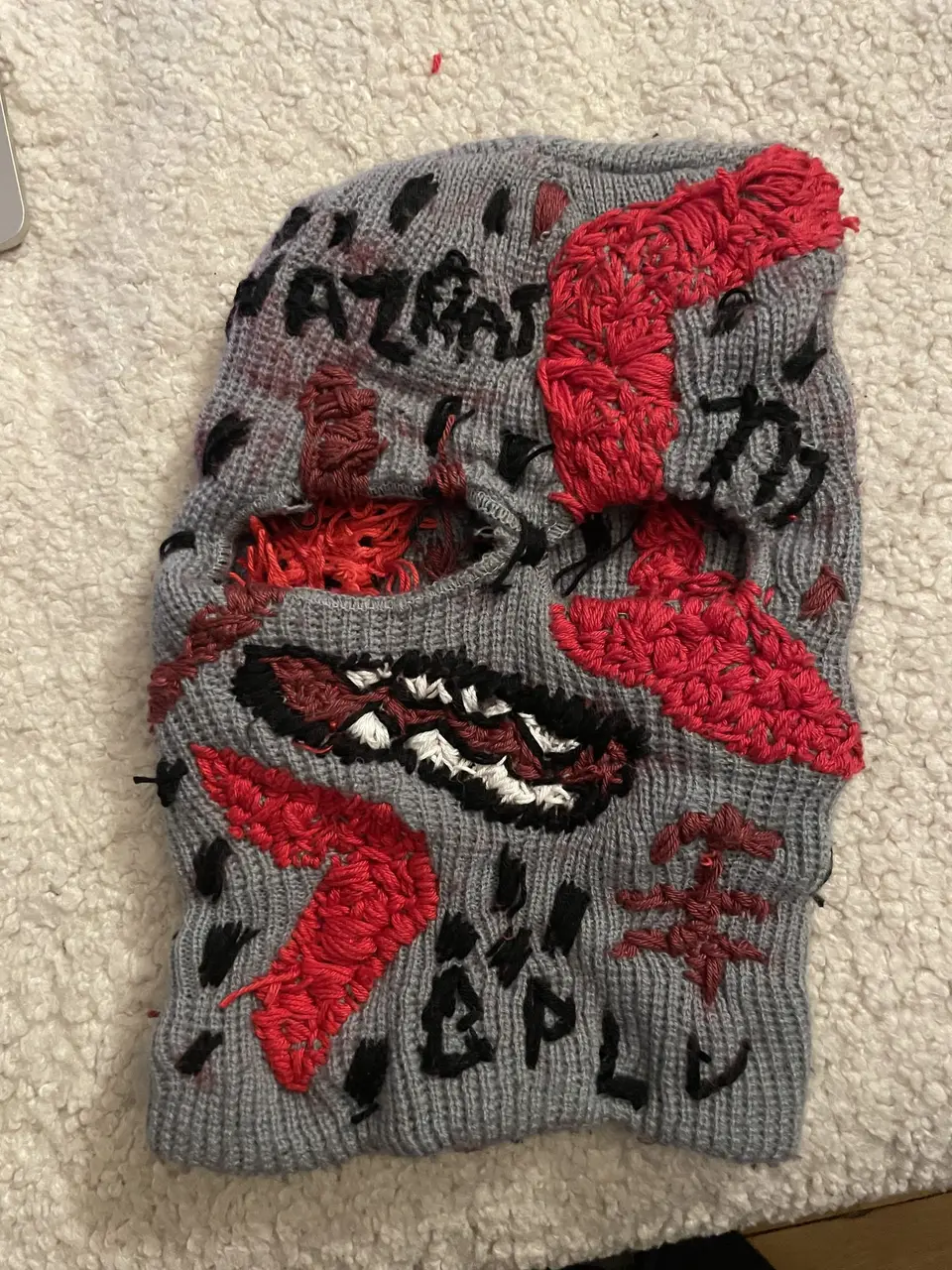 Ski mask Nº 7 from the front: mouth outlined in black, NAZRAT and BPLU lettering embroidered